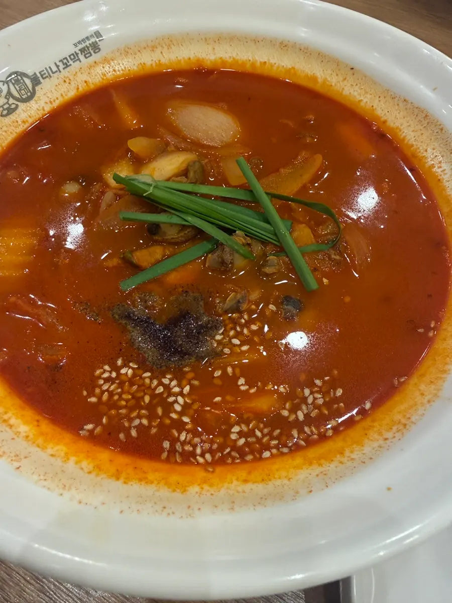 A table set with cockle jjamppong and tangsuyuk