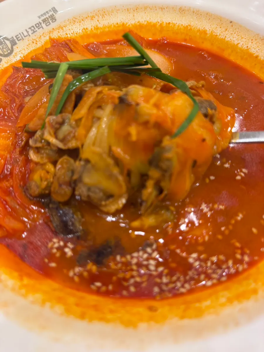 A bowl of cockle jjamppong placed on the table