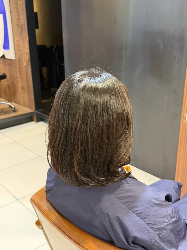 Bob with ends curled inward after the magic setting perm