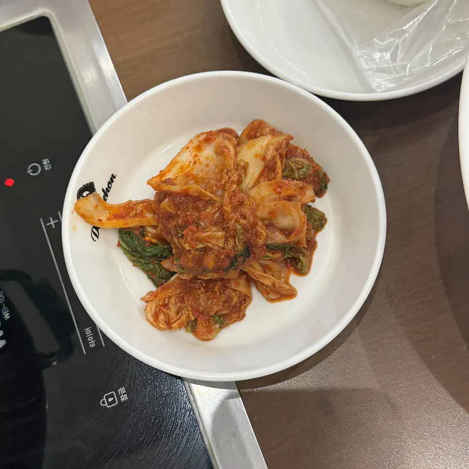 Crisp, crunchy kimchi served at Deungchon Shabu Kalguksu