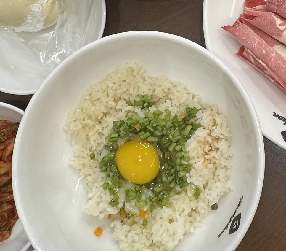 Fried rice ingredients with egg and minari before stir-frying