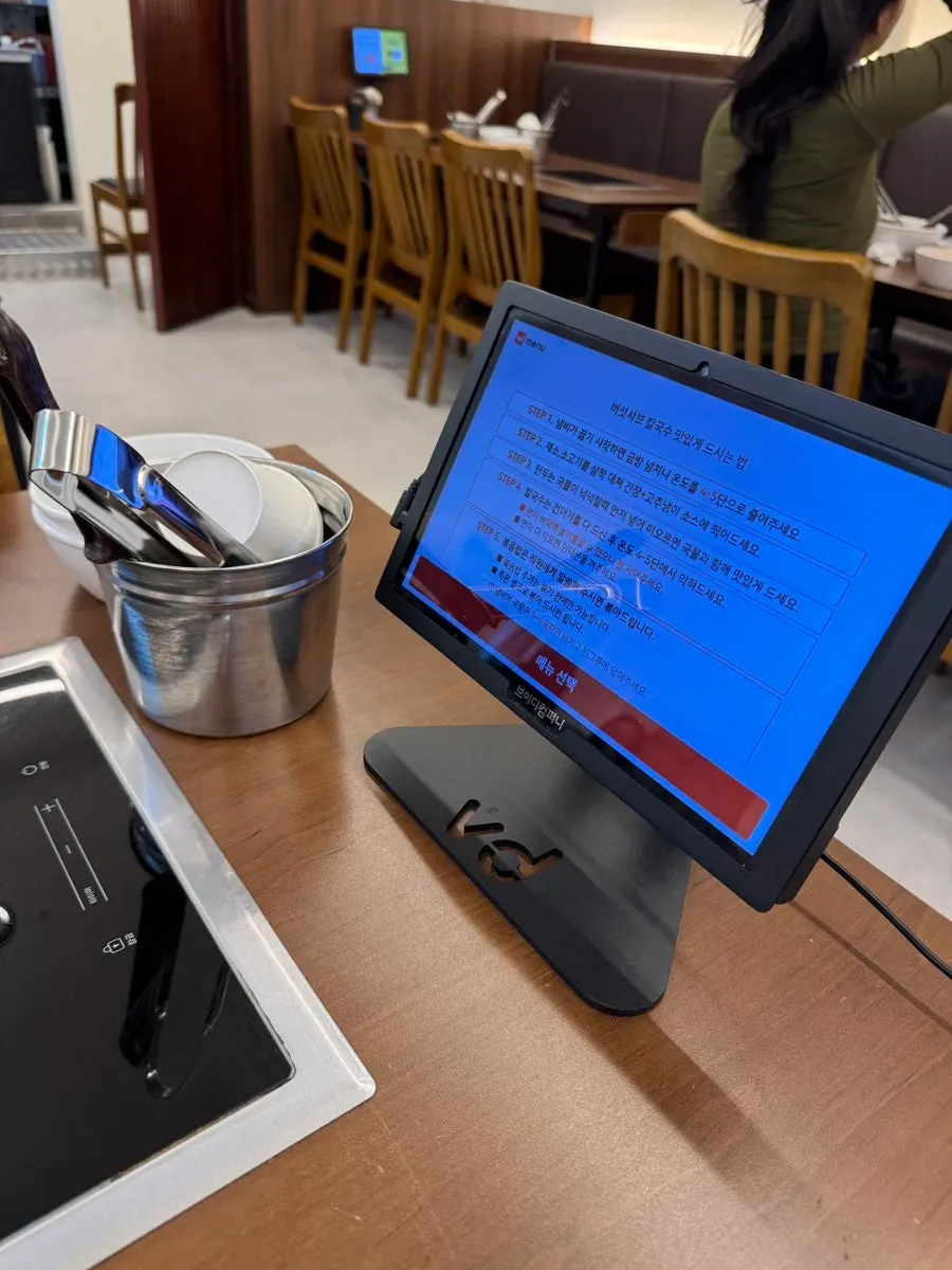 Menu board showing set menus and extra order prices
