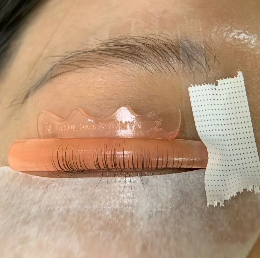 The lash lift treatment in progress