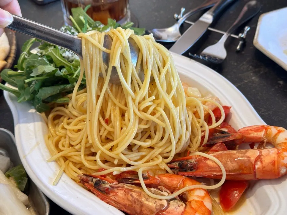 Pasta topped with tiger shrimp