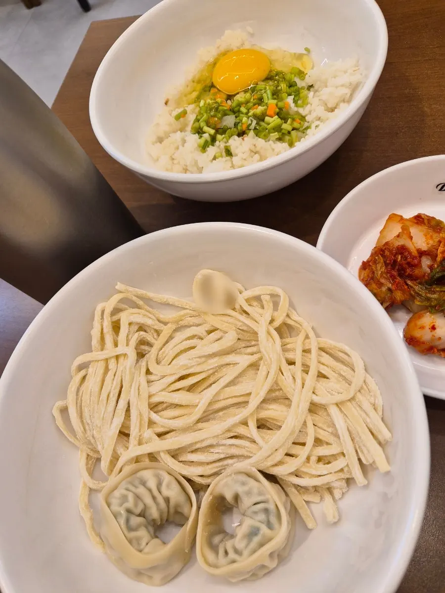 Plate of beef, kalguksu noodles, and dumplings