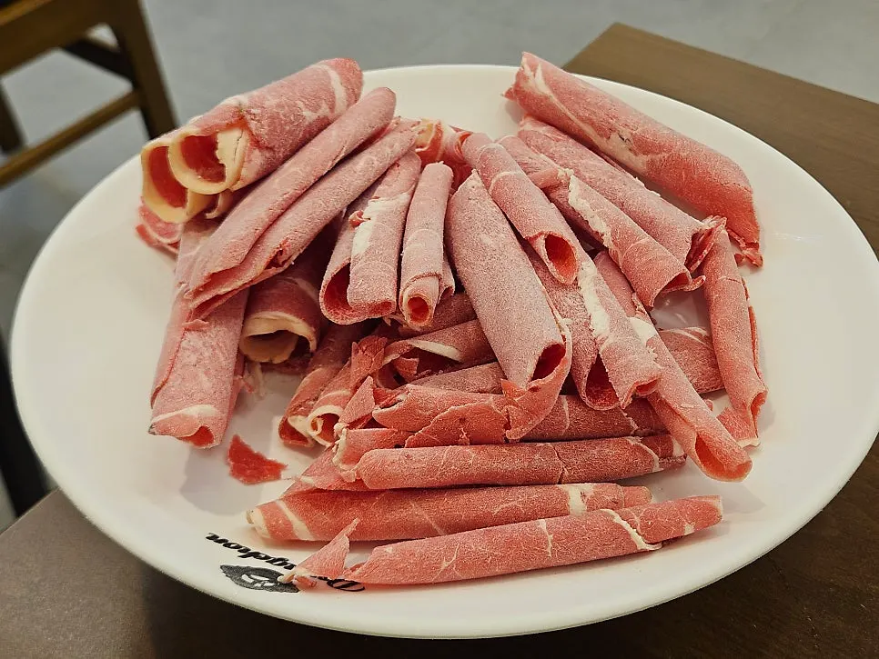 Plate of added minari vegetables and shabu beef