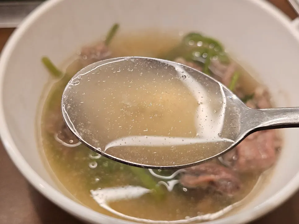 Shabu meat and vegetables scooped onto a small plate