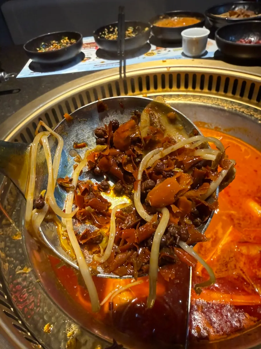 Chengdu red broth with red oil swirling on top
