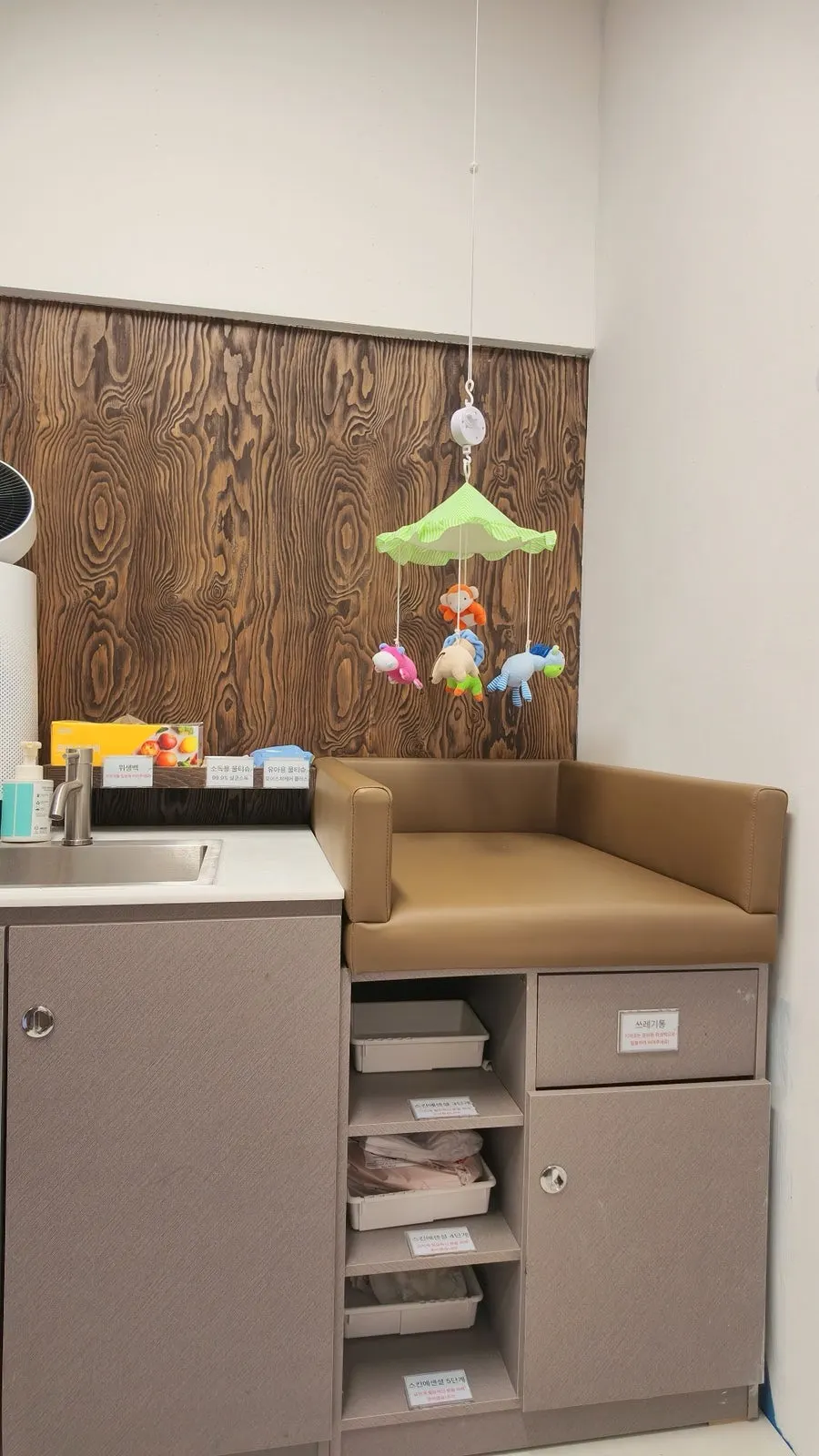 Inside the nursing room with diapers stocked by size