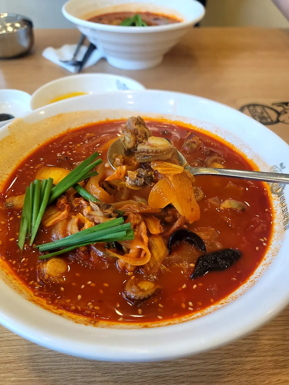 Close-up of cockles and clams topping the jjamppong