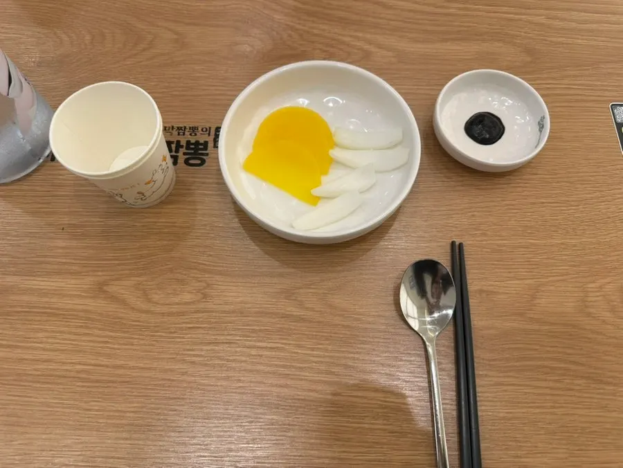 Pickled radish, onion, and chunjang side dishes set on the table