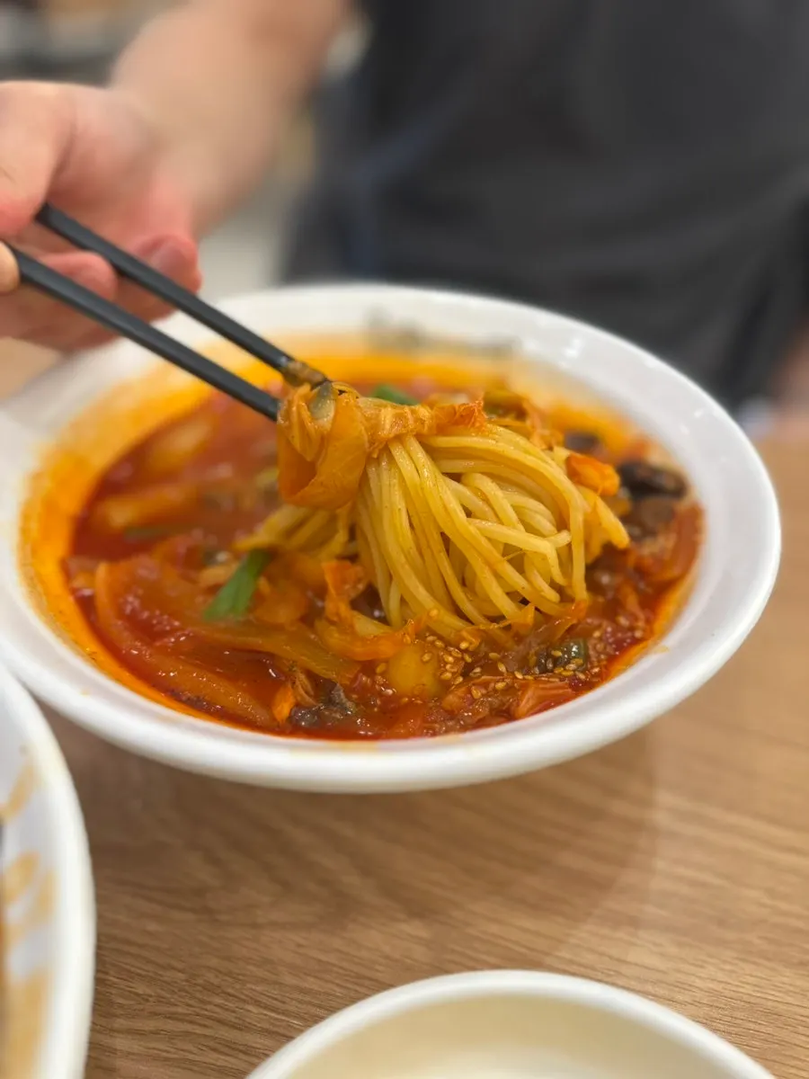 Bowl of kkomak jjamppong with deep red broth