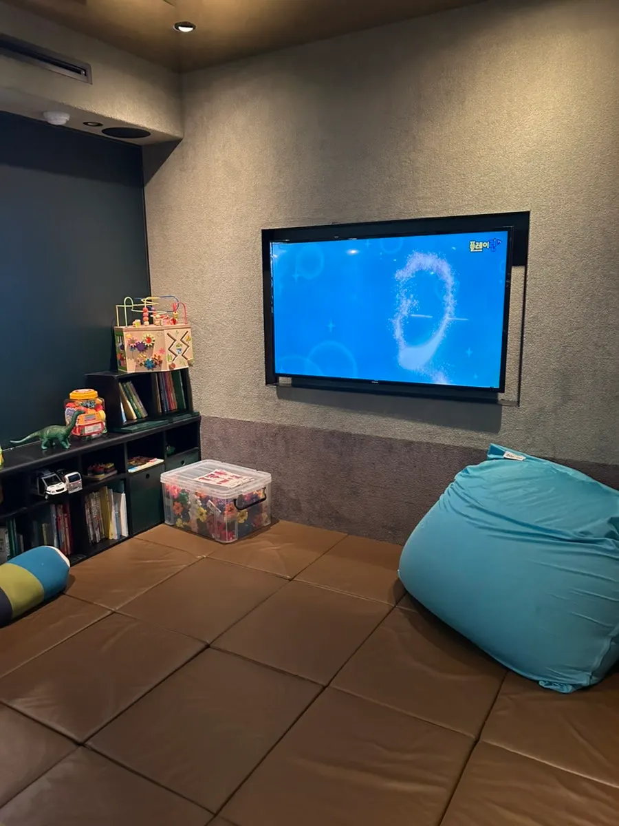 Inside the salon's kids room with beanbags