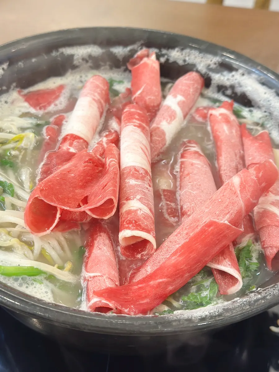 Beef and vegetables cooked in the broth
