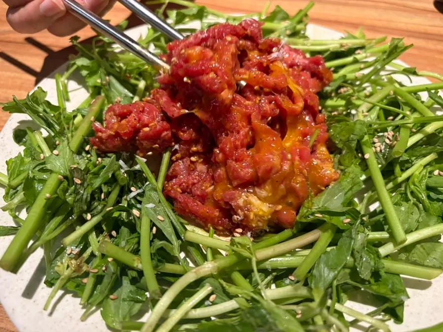 Hanwoo beef tartare mixed together with minari