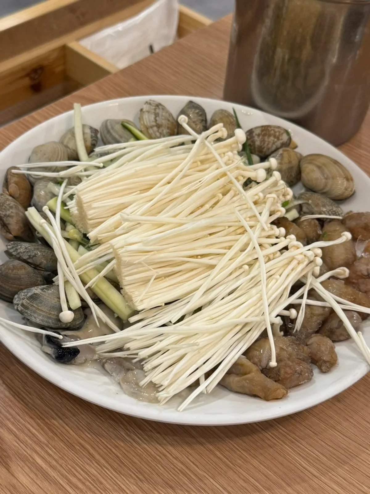 Two servings of pufferfish seafood kalguksu laid out