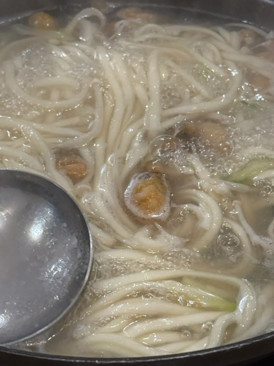 Close-up of the broth and seafood