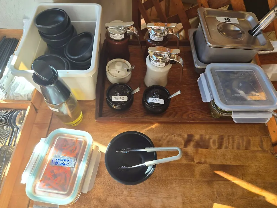 Homemade pickles and seasonings at the self-service bar