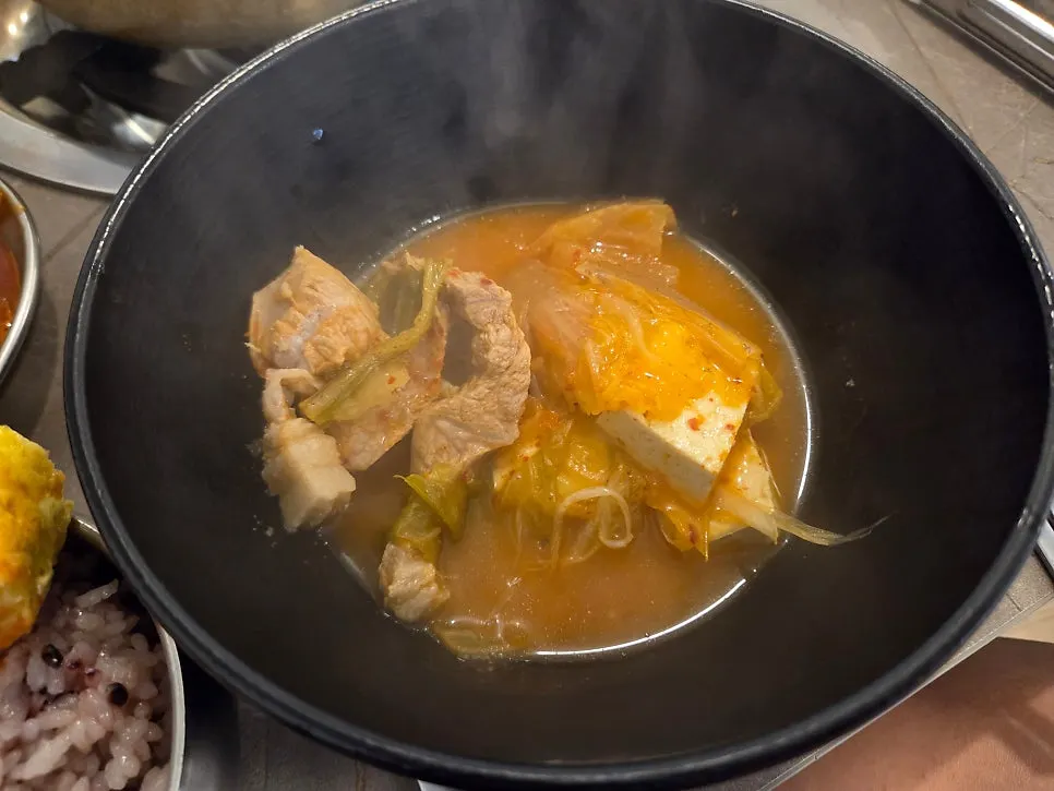 Kimchi jjigae with large, thick pieces of pork