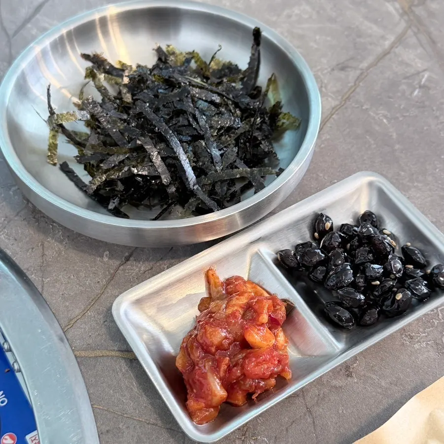 Basic side dishes of seaweed flakes, salted seafood, and soy-braised beans