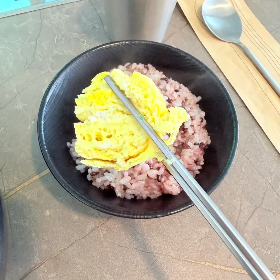 Rolled omelet served with ketchup