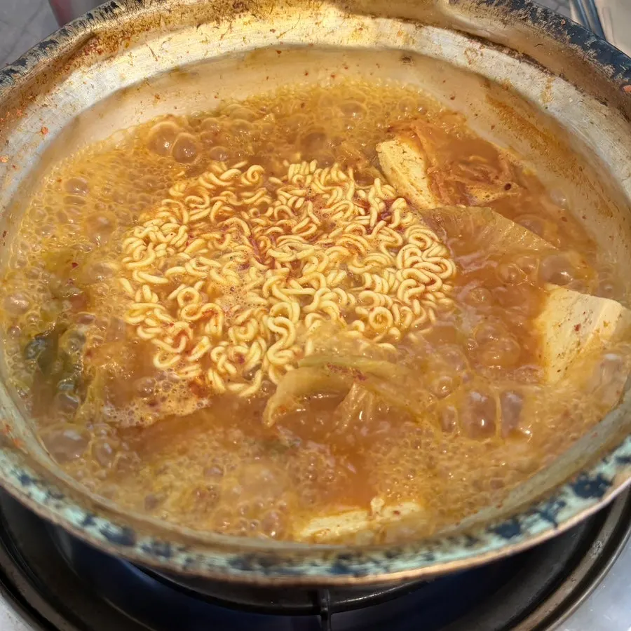 Ramen noodles added to kimchi jjigae