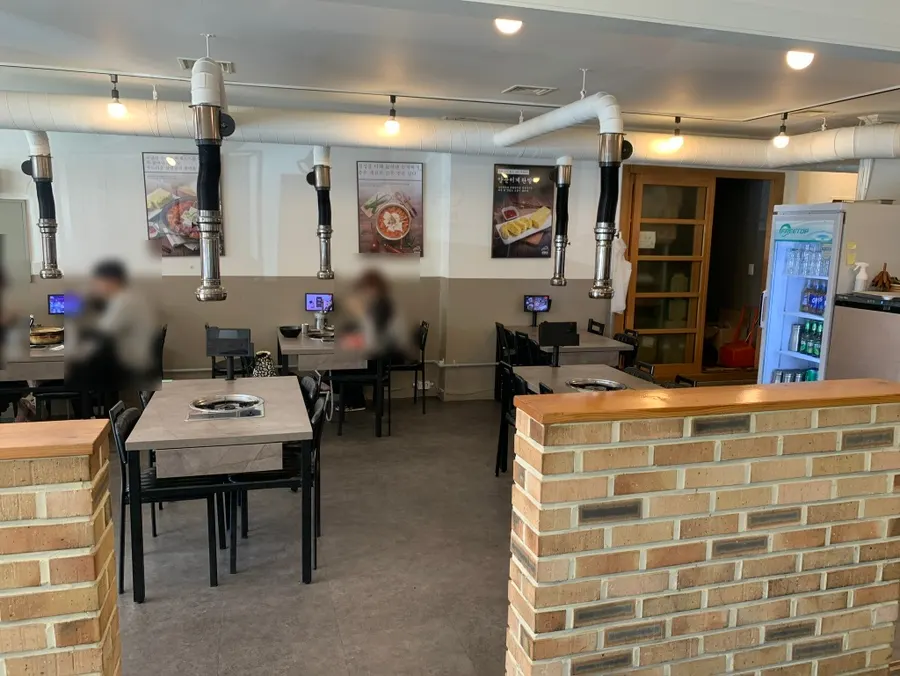 Interior of the restaurant with customers seated right after opening