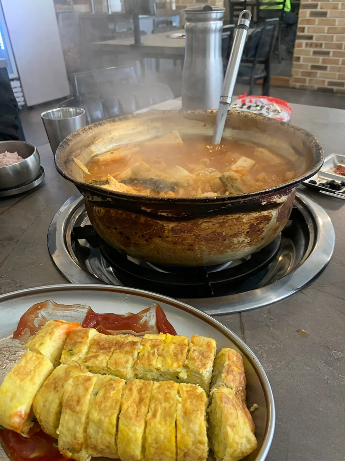 Two-person kimchi jjigae served in a large basin