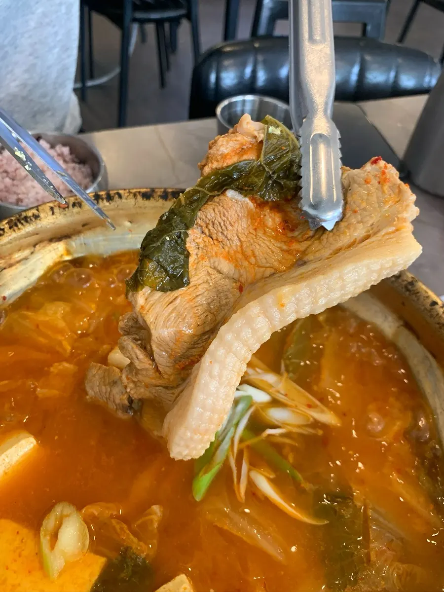 Large chunks of domestic pork in the kimchi jjigae