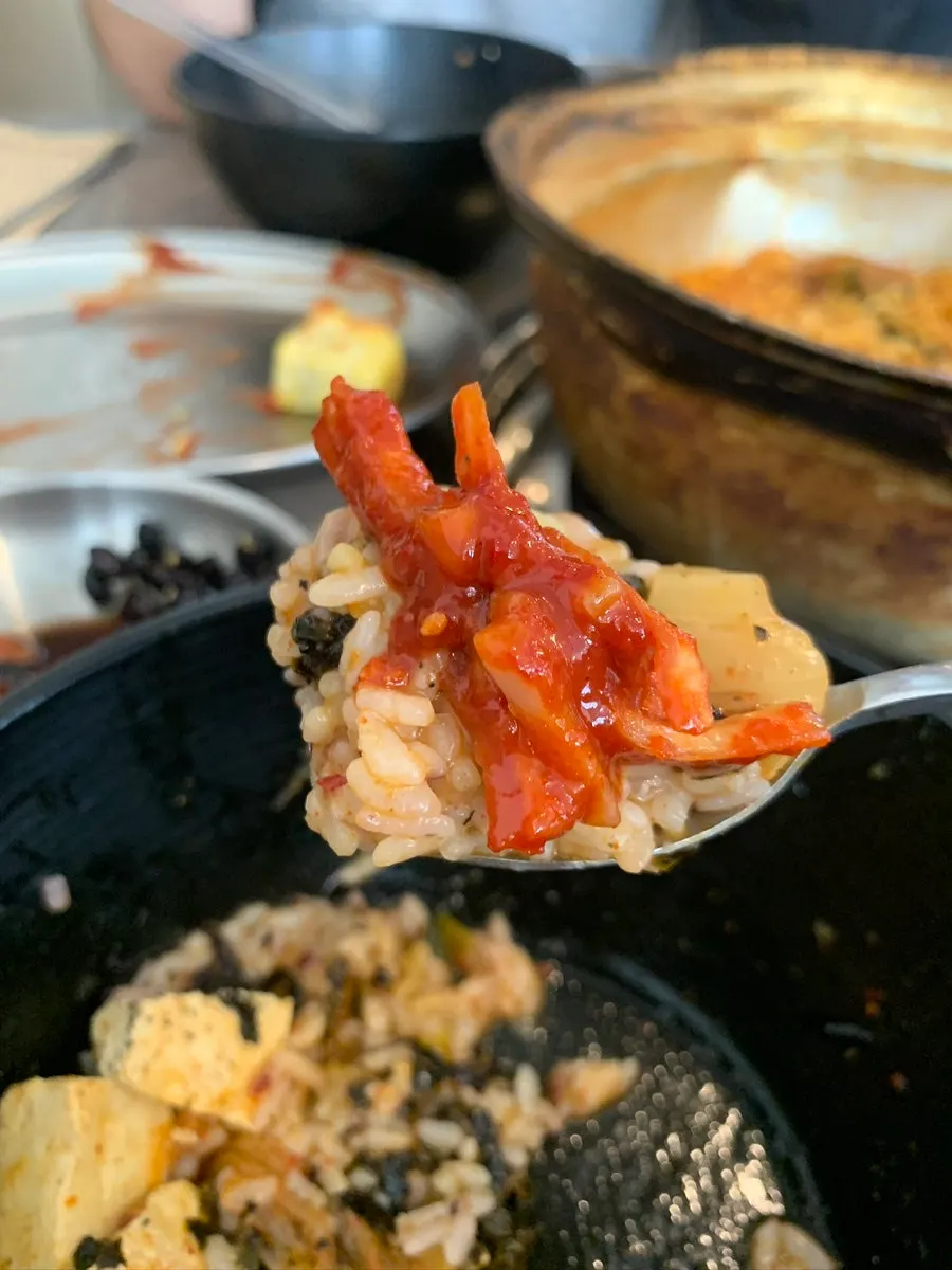 Cut pork and rice served from the kimchi jjigae