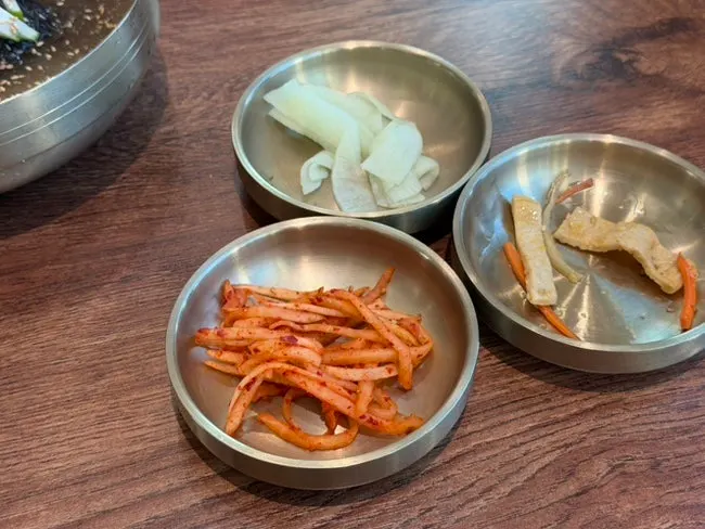 Basic side dishes including shredded radish salad and seasoned fish cake