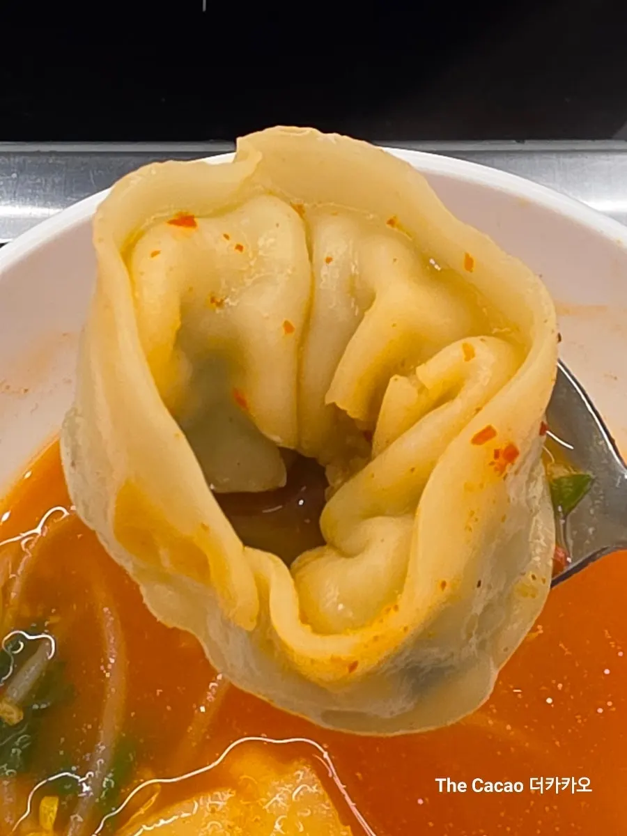 Dumplings cooking in the broth