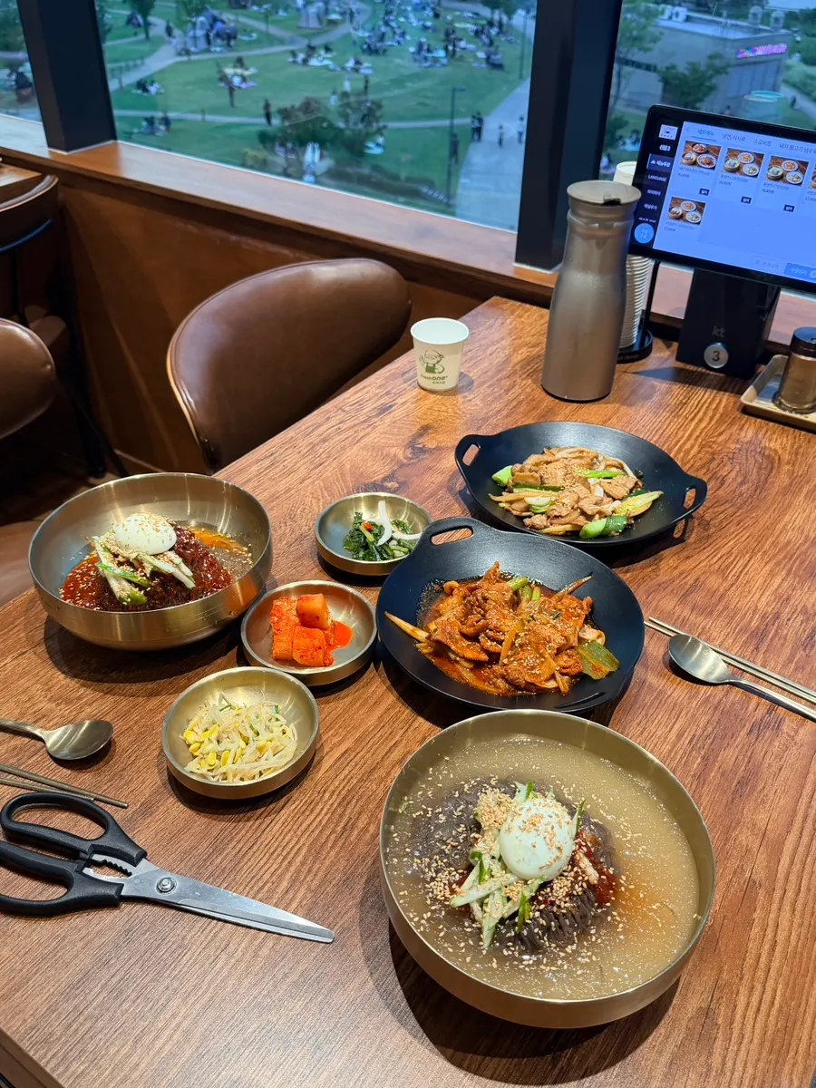 A generously portioned bowl of naengmyeon on the table