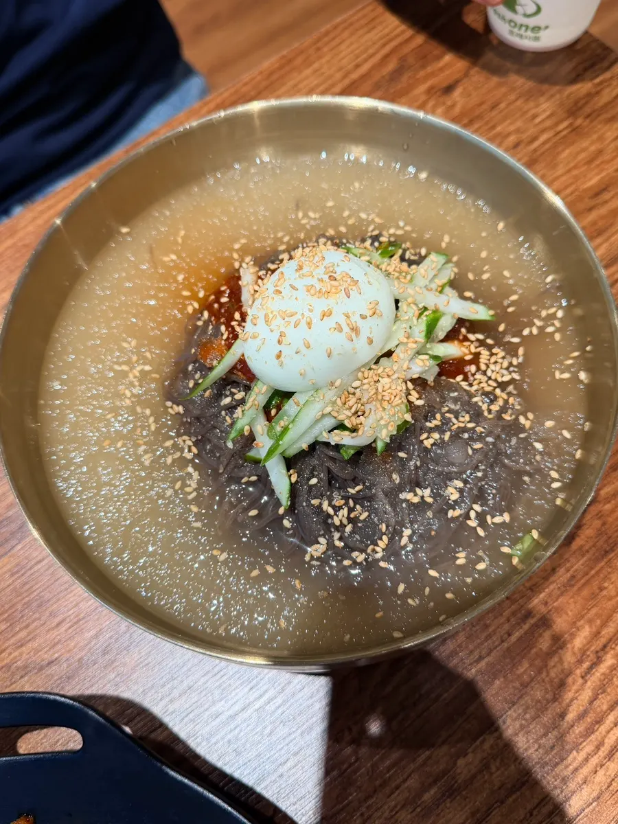 Mul naengmyeon broth with slushy ice floating on top