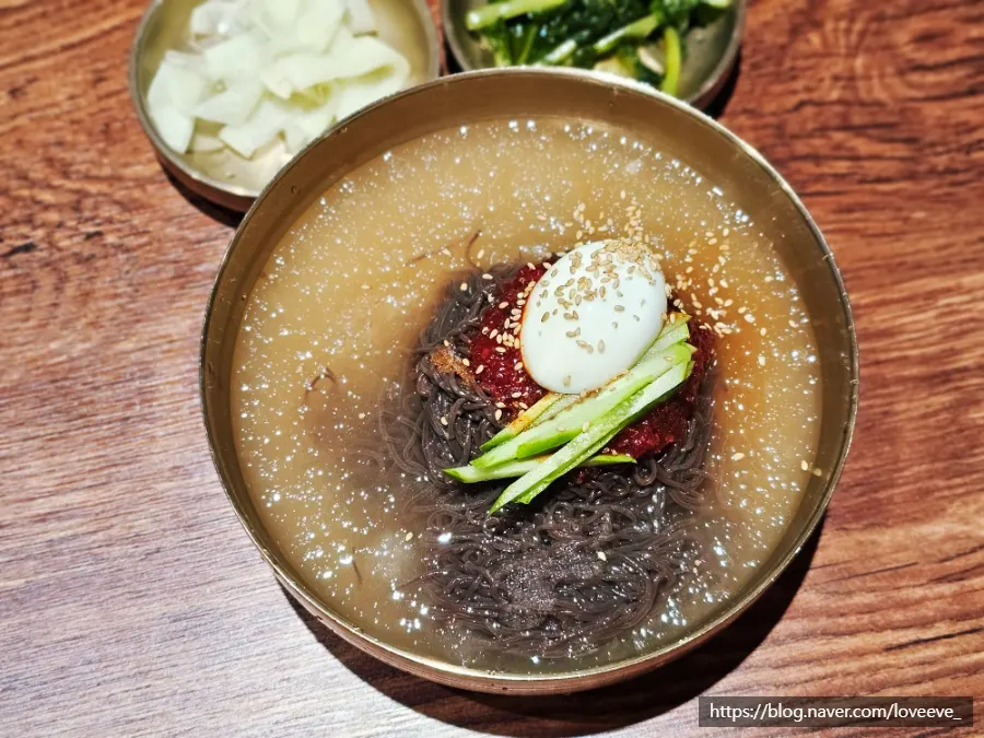 Bibim naengmyeon served with a side of broth