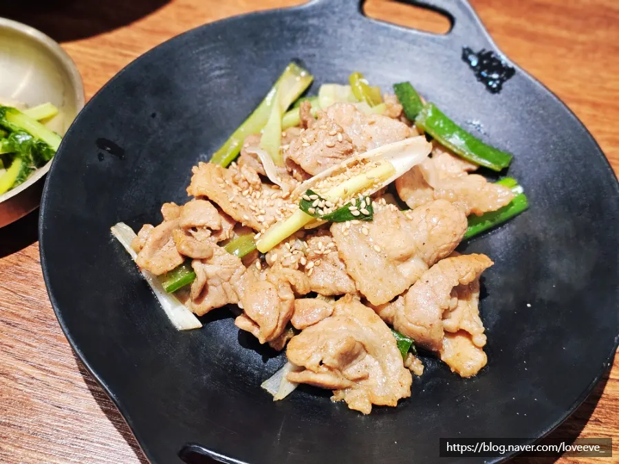 A plate of soy-glazed pork belly from the set