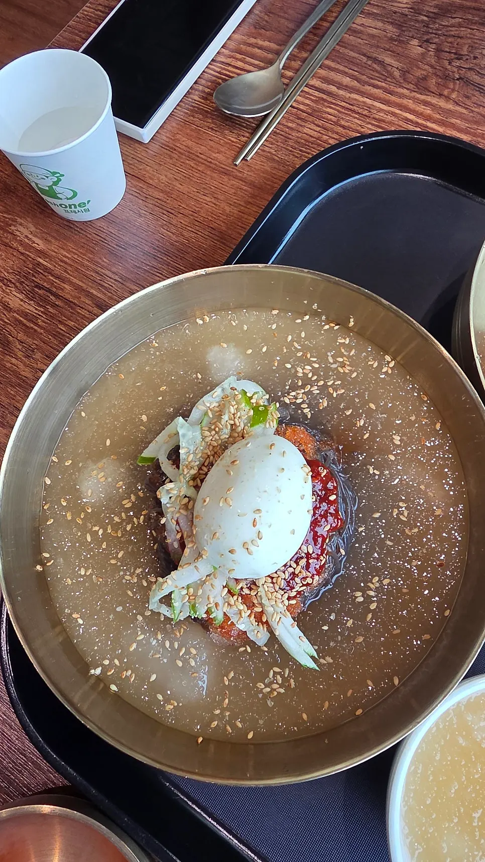 A bowl of cool mul naengmyeon with kudzu noodles