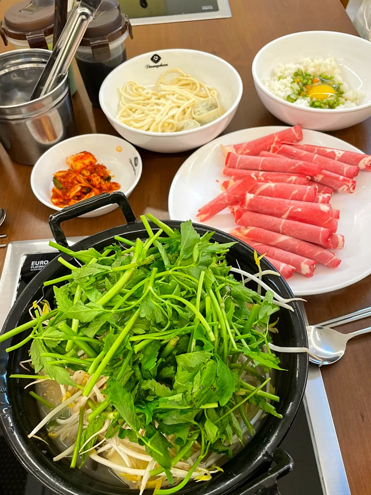 A full table of shabu kalguksu at Deungchon Shabu Kalguksu Gran Passage Branch