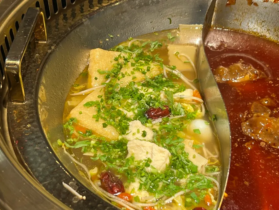 Beef rib soup broth with cilantro and chives added