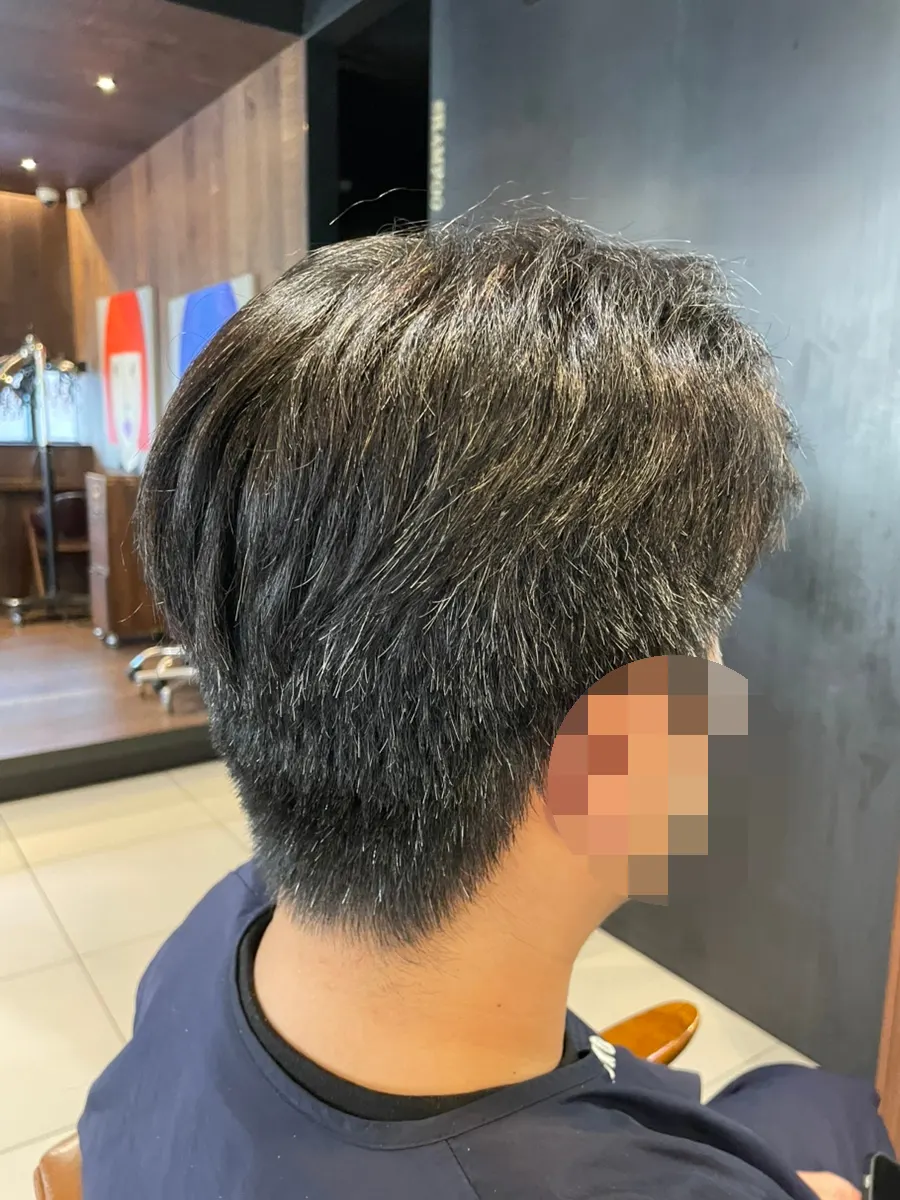 Husband's hair before the service, puffed out from curls