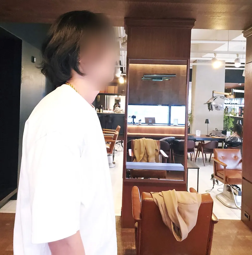 Hair grown out to mid-length