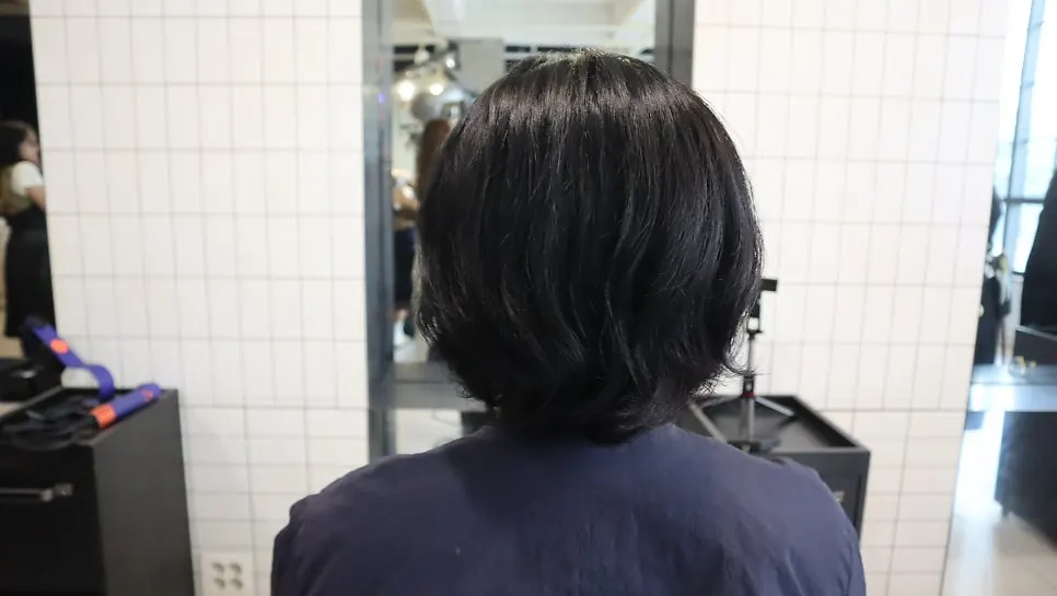 Back view after the cut and down perm