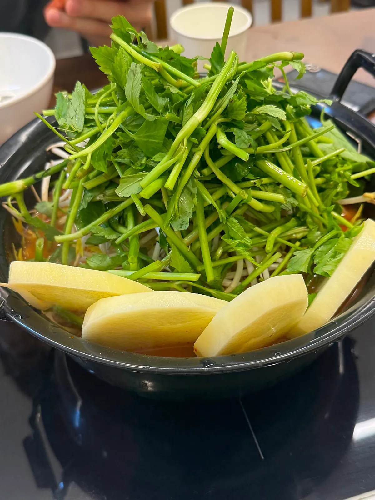 A generously packed pot of spicy mushroom kalguksu