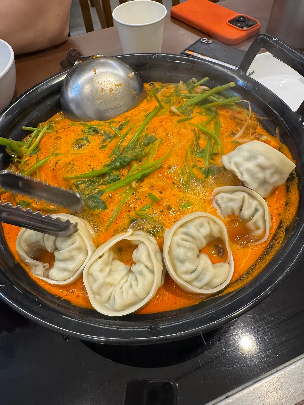 Pot piled high with minari and bean sprouts