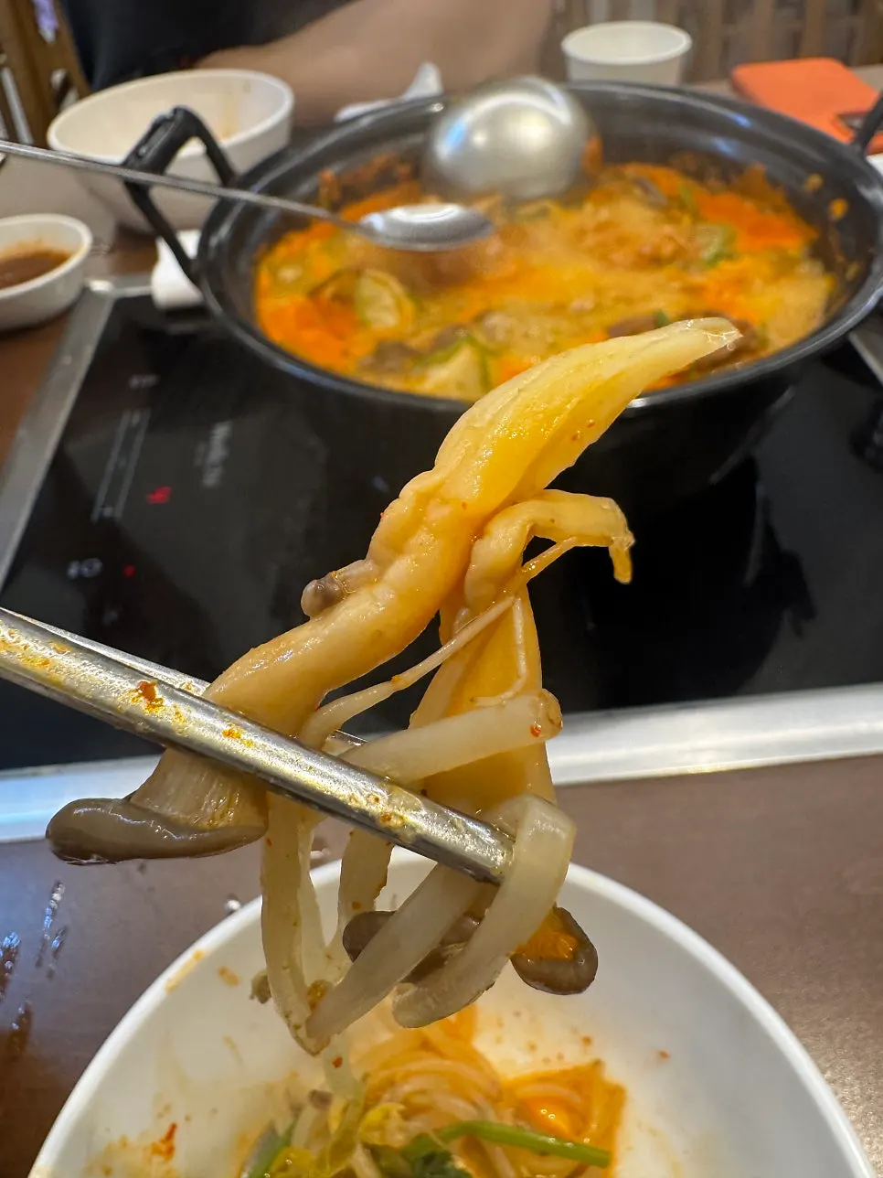 Beef shabu paired with mushrooms and minari