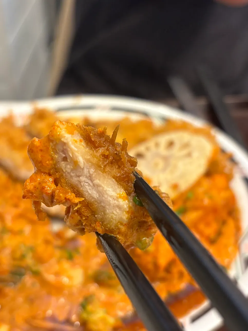 Picking up a piece of pork cutlet