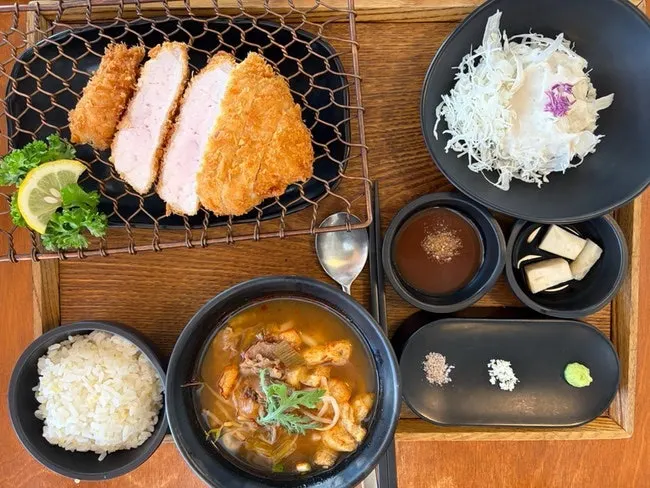 Table spread with loin cutlet and hwa-udon set