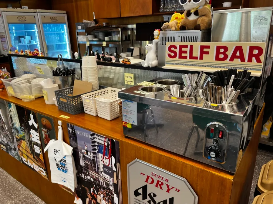Restaurant interior with subway hand strap bars and route map decor
