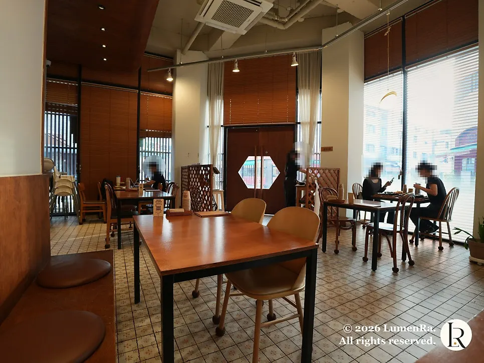 Hall tables with natural light and wood blinds