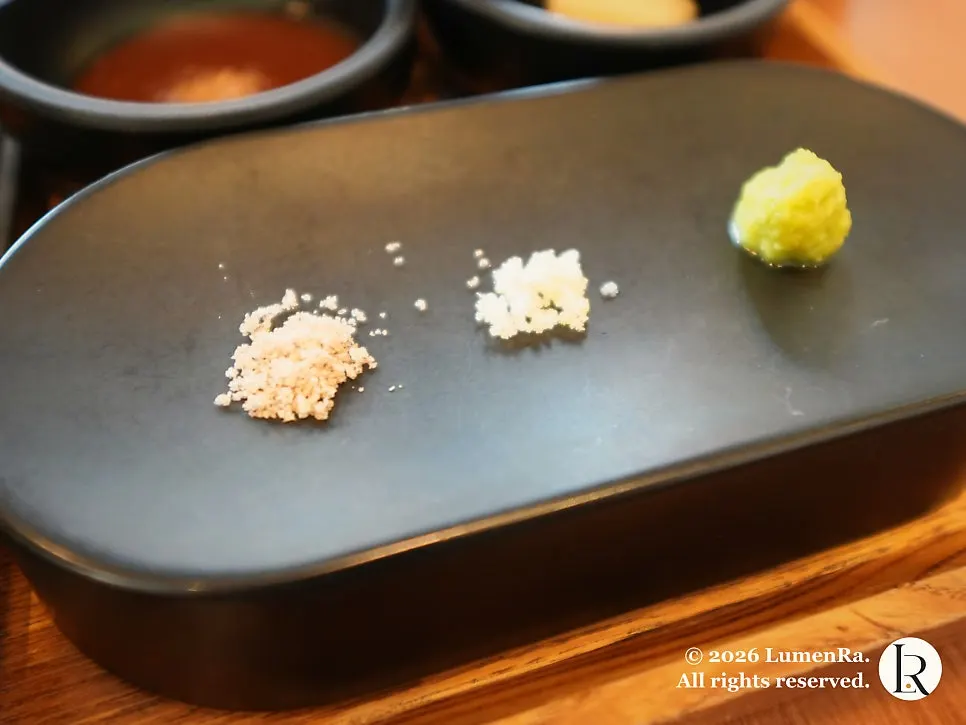 Three condiments: salt, lemon salt, and wasabi